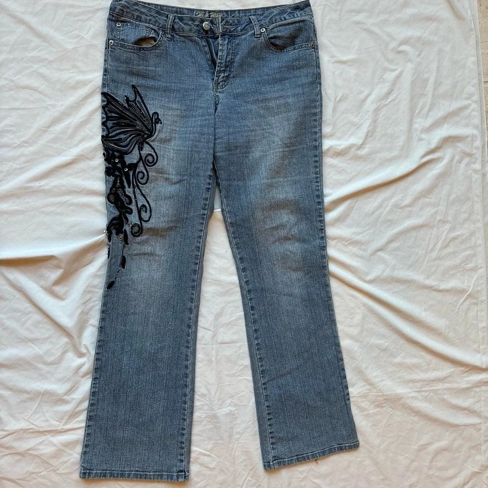 vintage Blue denim and black butterfly embroidered jeans with a low rise fit
